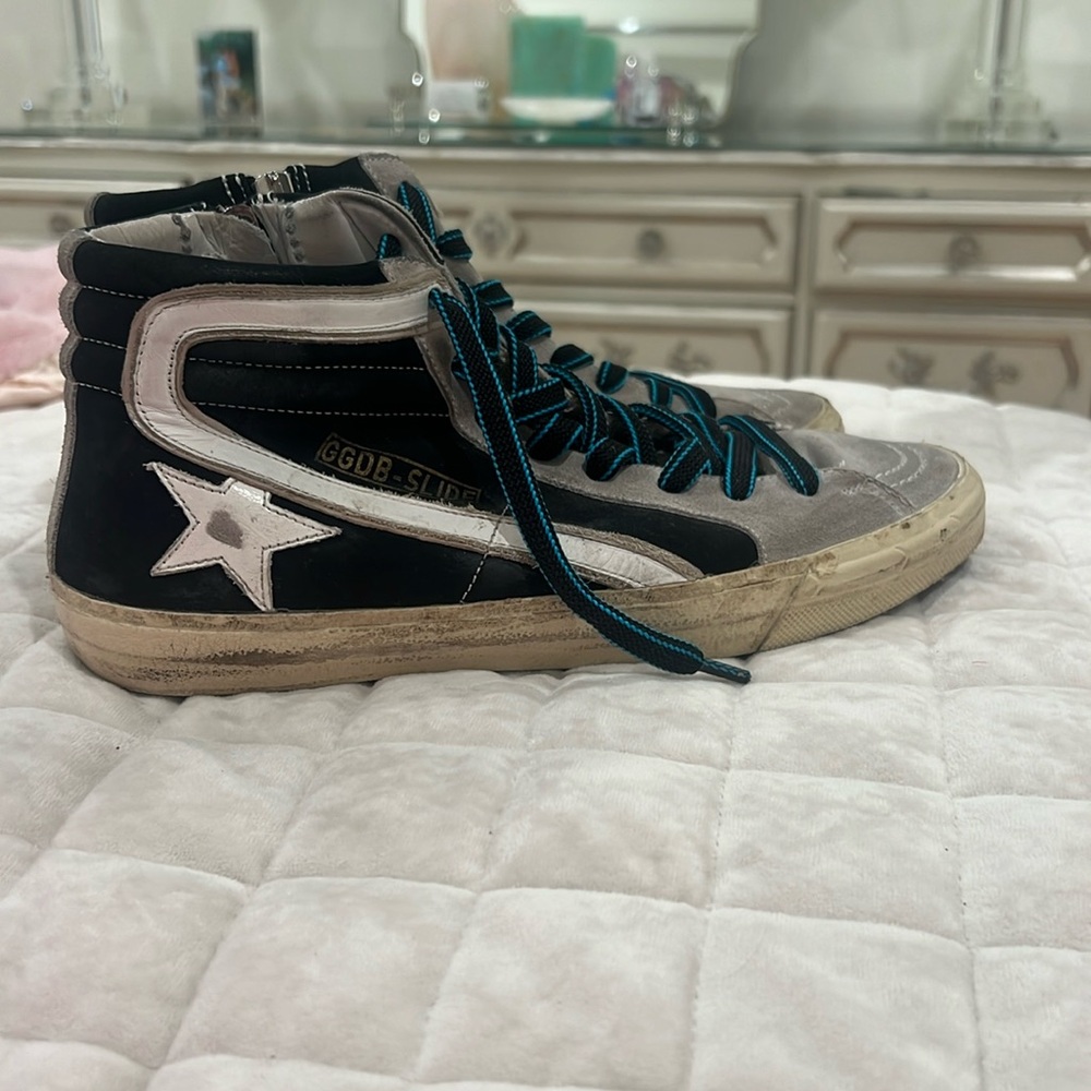 Black golden goose with blue and black stitched laces